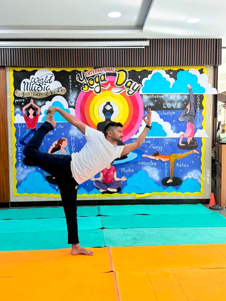 Yoga teacher balancing in dancer's pose